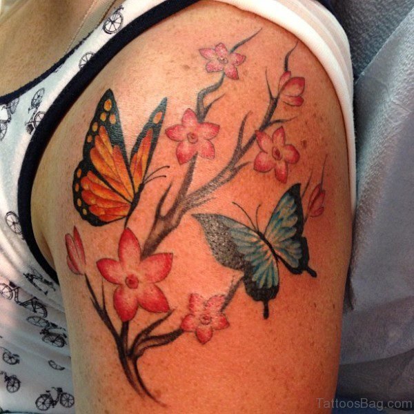 Orange Butterfly And Flower Tattoo On Shoulder