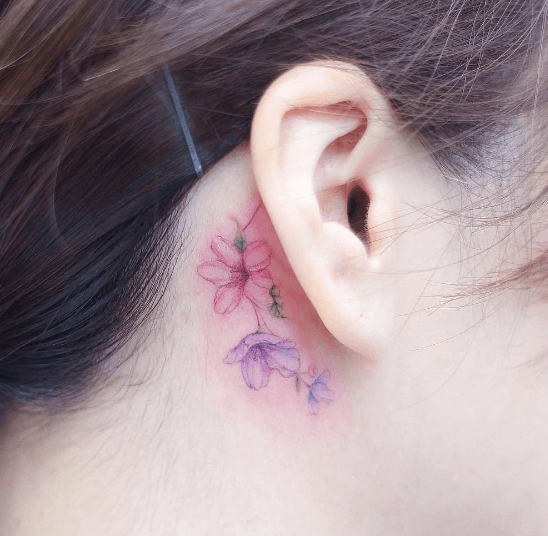 Delicate Flower Behind The Ear Tattoo