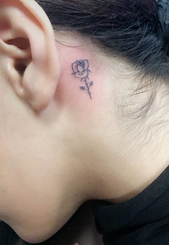 Tiny Black Rose Tattoo Behind The Ear