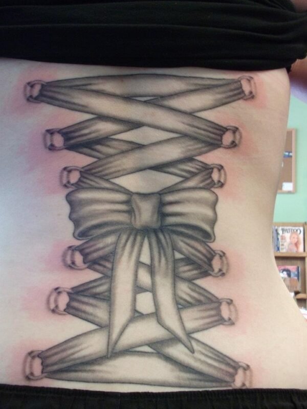 Grey Corest Bow Tattoo