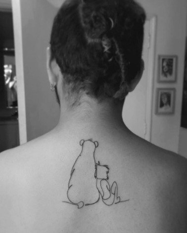 Sitting Mogli Tattoo